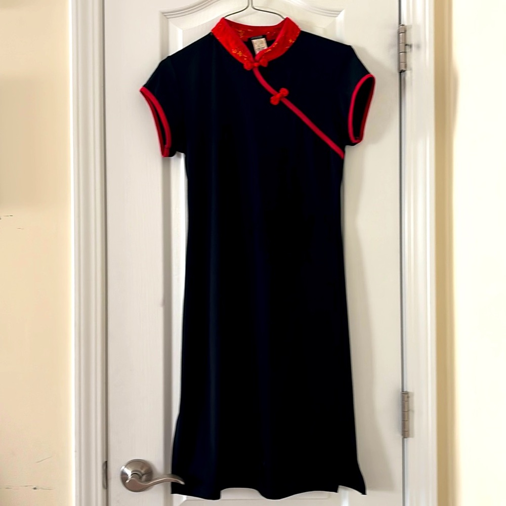 China child dress polyester silk red border.  6”Slit at bottom on both sides.